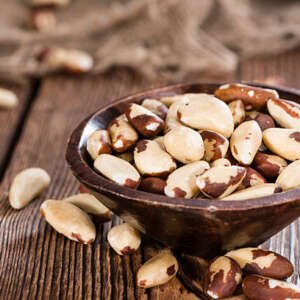 portion of healthy brazil nuts as detailed close up shot)