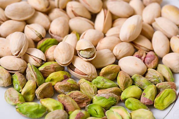 shelled and unshelled roasted pistachios. shelled and unshelled roasted pistachios.