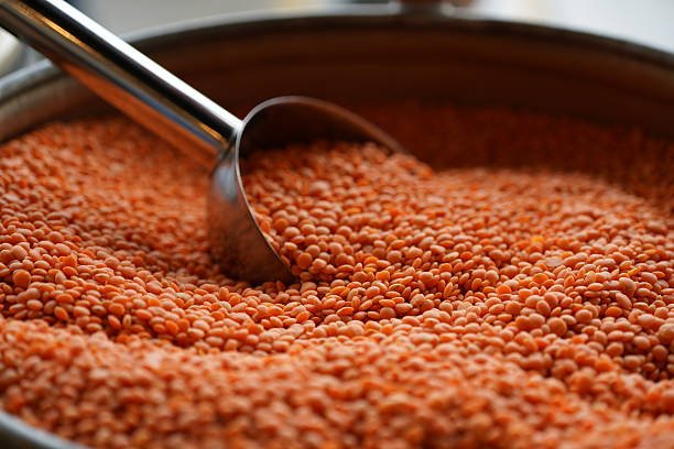 orange lentils in a display case for sale