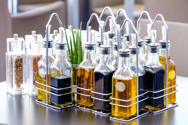 bottles with oil and vinegar at a restaurant bottles with oil and vinegar at a restaurant
